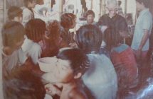 Fr. Joe with kids at table in Songkhla camp